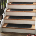 Alfombras antideslizantes RIOLAND para escaleras de madera, para interiores, 23 x 91 cm, con adhesivo reutilizable, paquete de 15 unidades. Alfombras autoadhesivas para escaleras, ideales para niños, ancianos y perros. Color negro diamante.