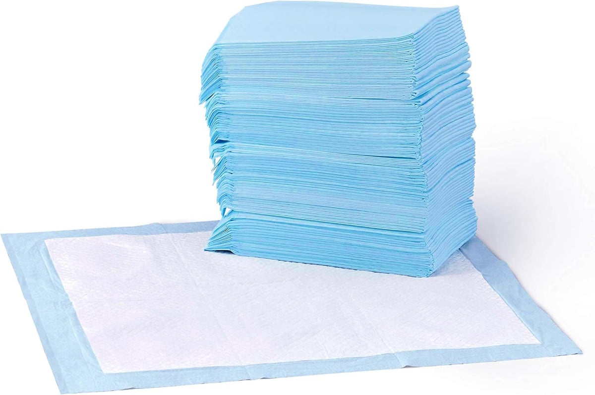 Almohadillas absorbentes Amazon Basics a prueba de fugas para el entrenamiento de perros y cachorros, con superficie superabsorbente de 5 capas de secado rápido para el entrenamiento canino y la protección del suelo, paquete de 50 unidades
