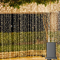 Cortina de luces LED Solhice para exteriores, 15 m x 3 m, 1000 luces LED colgantes con enchufe para interiores y dormitorios, fondo de luces centelleantes para decoración de bodas al aire libre, blanco cálido (no conectable).