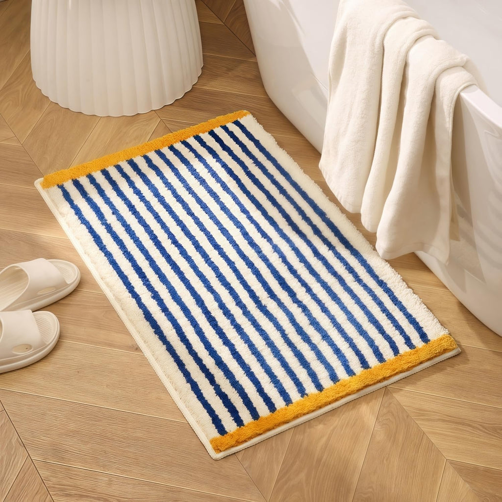 Alfombra de baño GIB de 81 x 51 cm, extra suave, absorbente y mullida, antideslizante y lavable, ideal para el suelo del baño o la ducha. Accesorios de decoración para el hogar. Rayas azules y blancas con detalles amarillos.