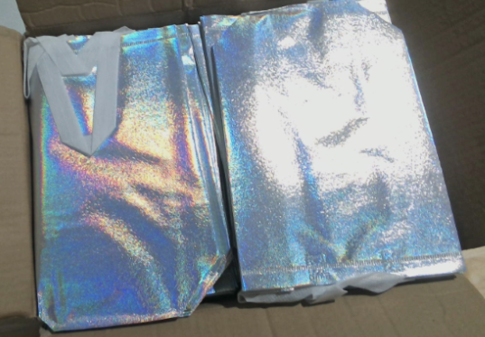 Nuevo, caja abierta: 100 bolsas de regalo holográficas reutilizables