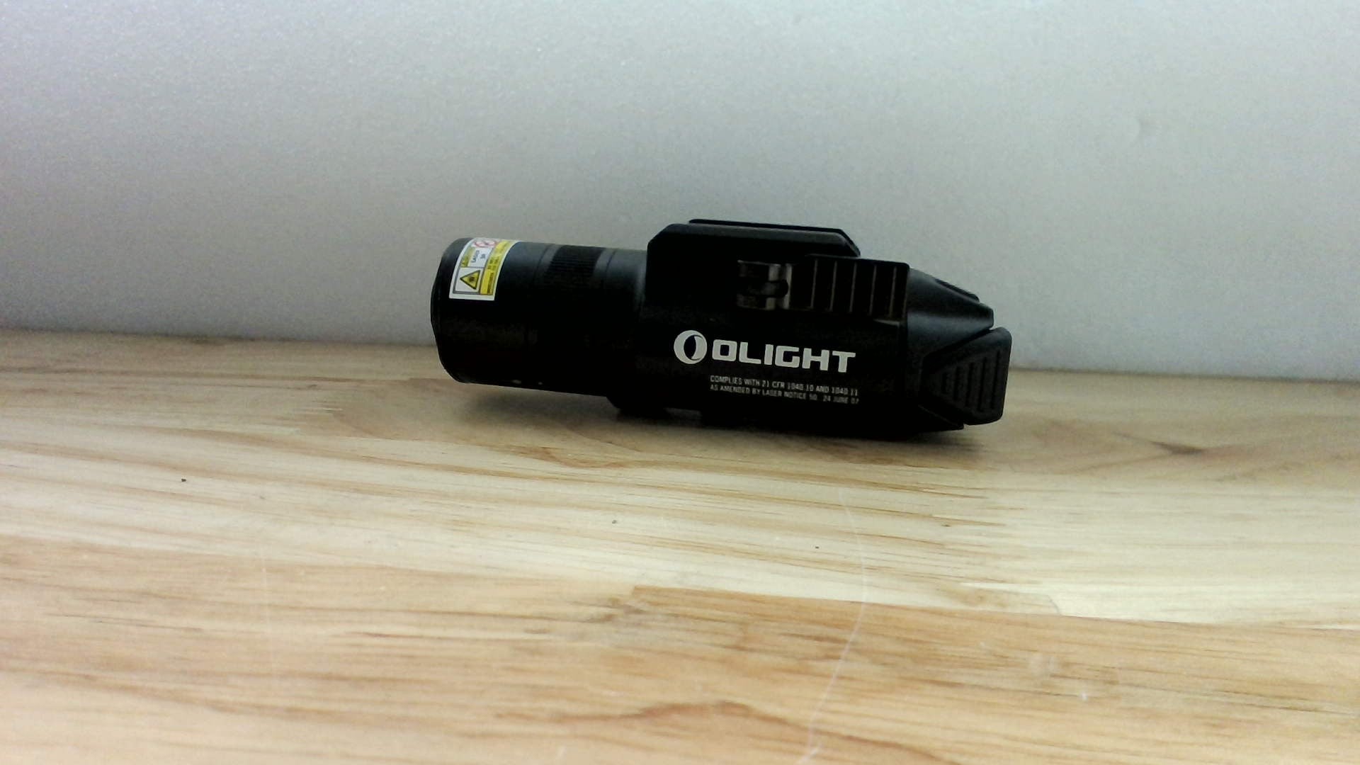 Linterna Táctica OLIGHT Baldr Pro R – 1350 Lúmenes, Haz Verde, Recargable, Alcance 200 m, Color Negro