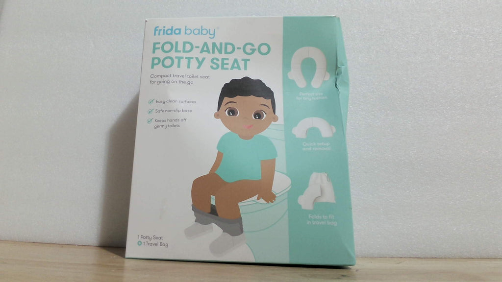 Asiento de inodoro portátil y plegable Frida Baby para entrenamiento infantil