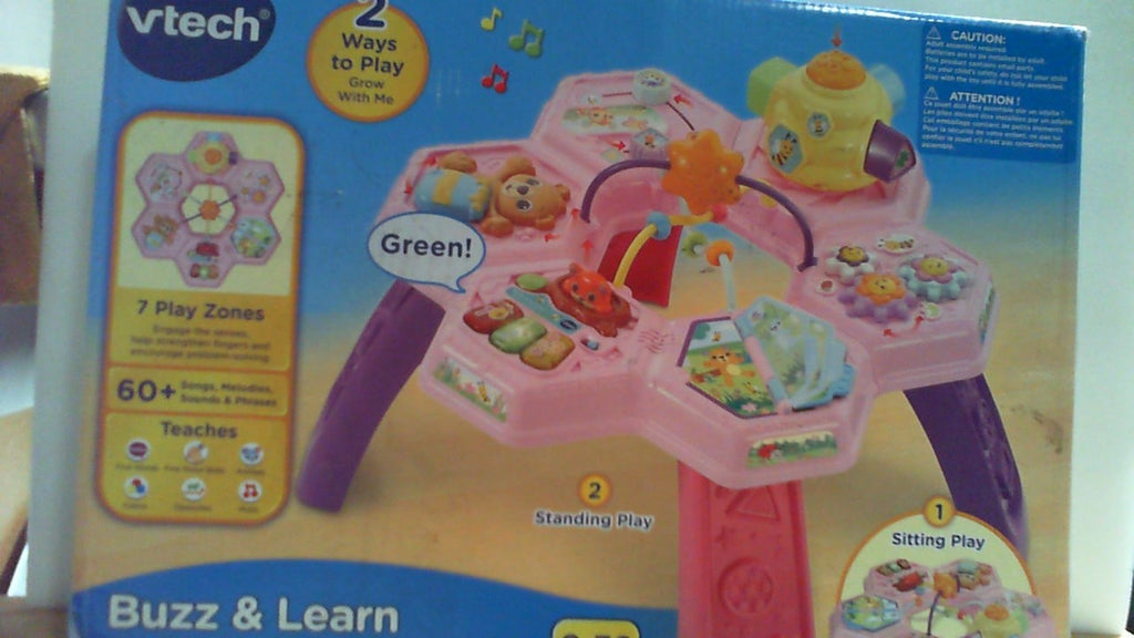 Mesa de actividades VTech Buzz and Learn con siete zonas de juego interactivas, color rosa.
