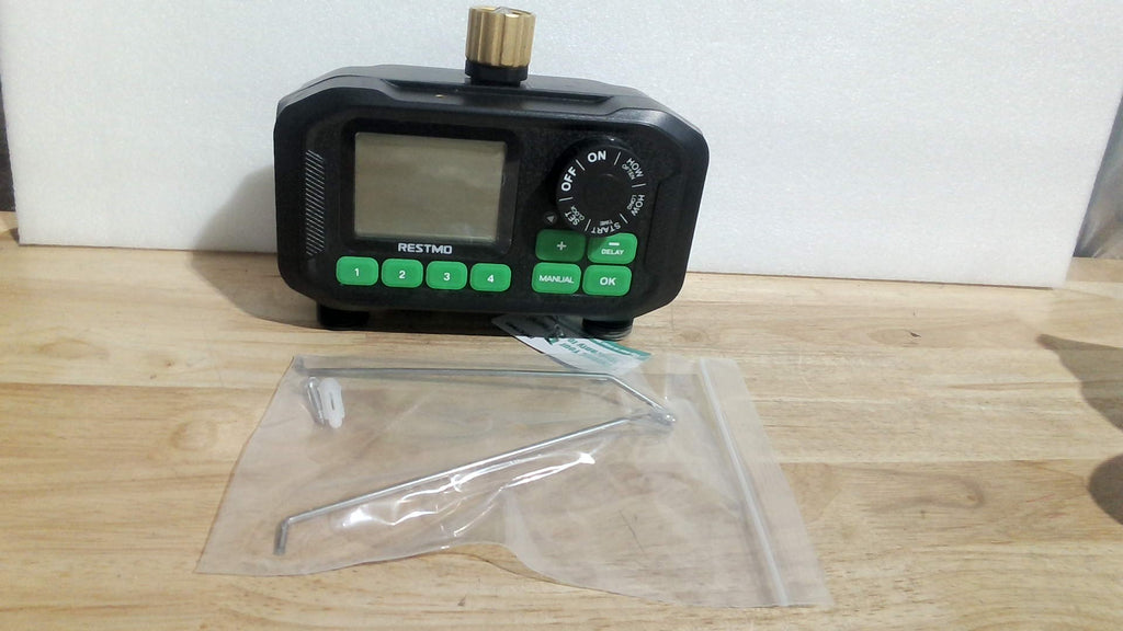 temporizador de riego automático digital de 4 zonas de la marca RESTMO (4-Zone Water Timer),solo contiene una pieza