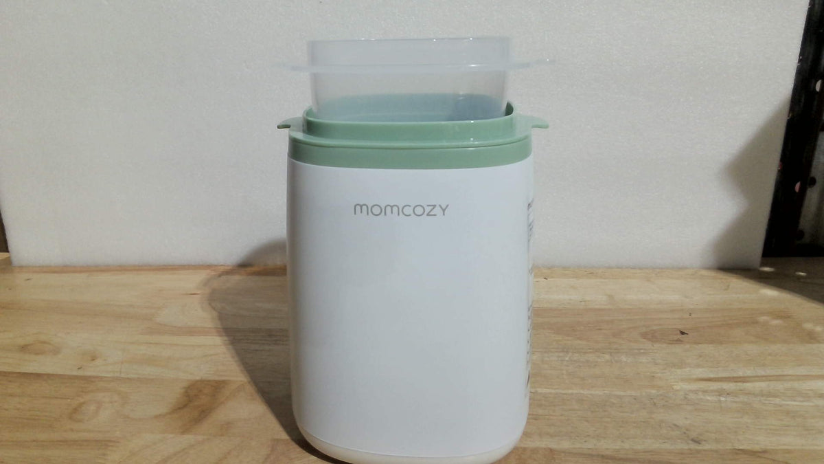 calentador de biberones inteligente e instantáneo de la marca Momcozy  (NOTA NO VIENE CON EL BIBERON )