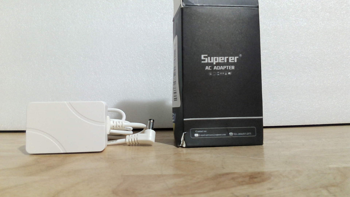 cargador o adaptador de corriente alterno (AC Adapter) de la marca Superer, ARTICULO VIENE COMO SE MUESTRA EN LA SEGUNDA IMAGEN