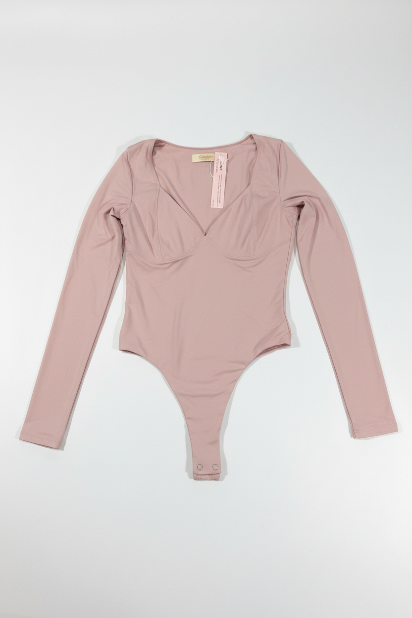 Bodysuit rosa manga larga flat lay