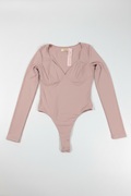 Bodysuit rosa manga larga flat lay