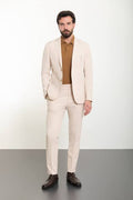 traje sastrero de dos piezas (saco o abrigo casual y pantalón)