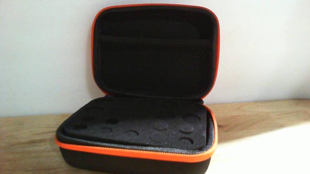 estuche rígido portátil de EVA con cremallera naranja, diseñado para organizar y proteger botellas de aceites esenciales.