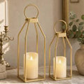 linterna decorativa de metal dorado con vela LED integrada y control remoto.