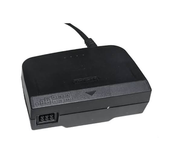 fuente de alimentación (adaptador de corriente AC) para la consola de videojuegos retro Nintendo 64 (N64). ( ARTICULO VIENE COMO SE MUESTRA EN LA SEGUNDA IMAGEN )