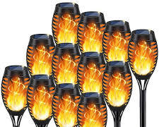 antorchas solares LED con efecto de llama parpadeante con pinchos.