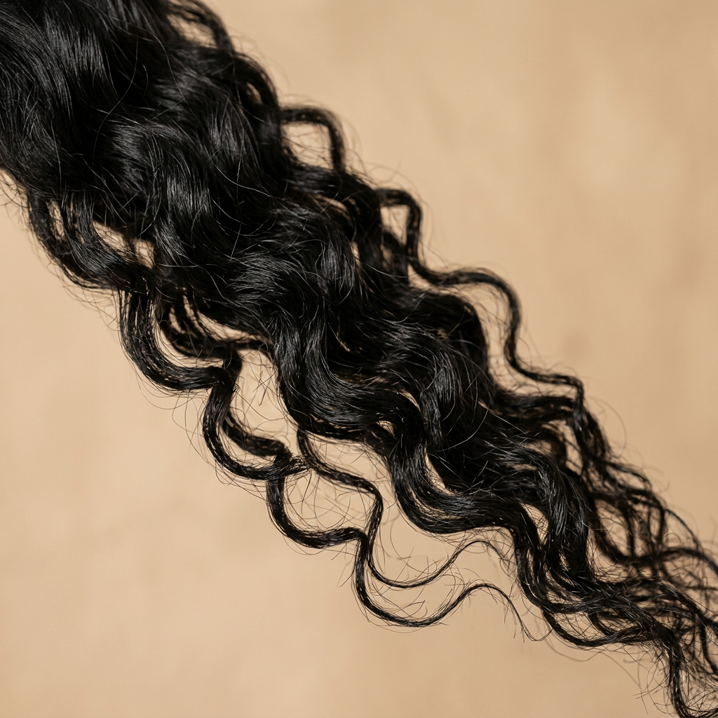 Cabello negro rizado pelo por pelo con ondas definidas