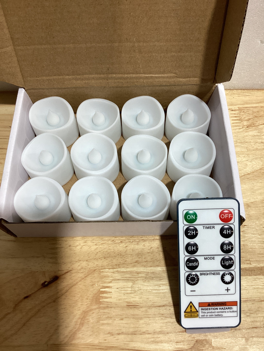 Homemory - Paquete de 12 velas votivas LED sin llama, funciona con baterías, velas de té falsas eléctricas de más de 200 horas para uso votivo, aniversario, centro de mesa de bodas, funeral, Halloween
